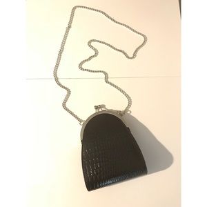 Reptile print clutch purse